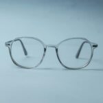 silver framed eyeglasses on white surface